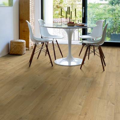 dining space with quick step soft oak medium laminate flooring