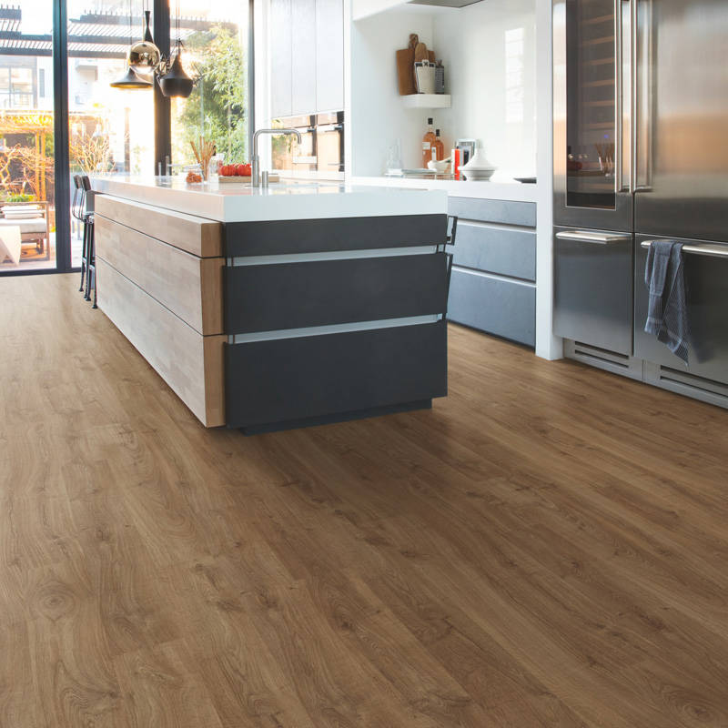 modern kitchen space with quick step new castle oak brown laminate floor