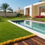 kakadu artificial grass in villa back garden next to pool and decking with clear sky