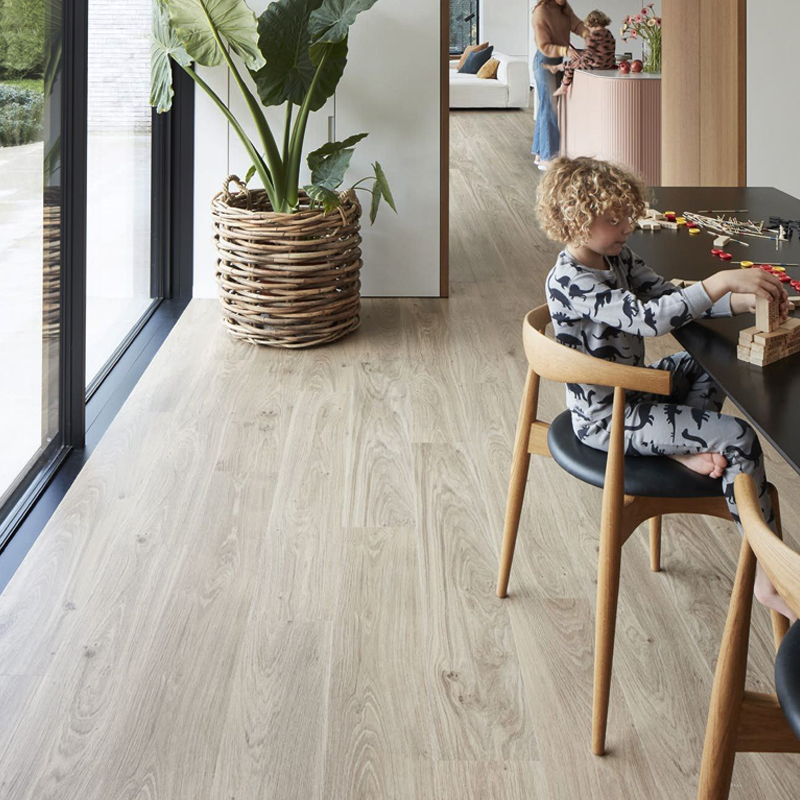 berry alloc pure planks authentic oak light grey vinyl click planks in living room with child