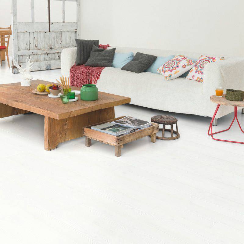 quick step white wood laminate plank flooring in a living space