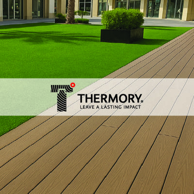 thermory logo imposed over picture of light brown outdoor decking