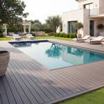 chocolate brown smart decking next to pool and lounge set in garden