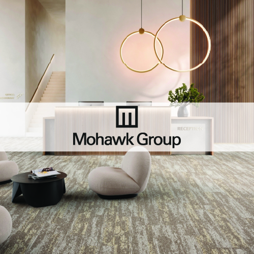 mohawk group logo imposed over an office space with grey and white patterned carpet