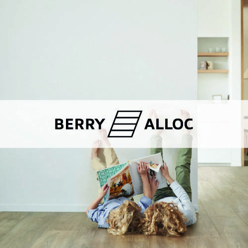 berry alloc logo imposed over a mother and child lying against a wall on a wooden floor