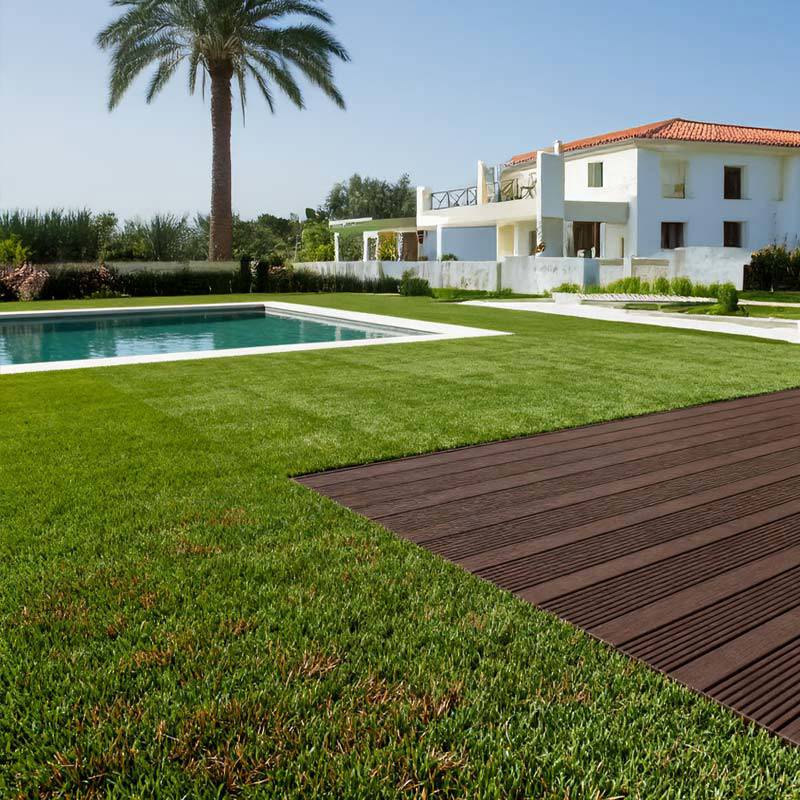 redwood 45 artificial grass turf in villa back garden with pool and palm tree