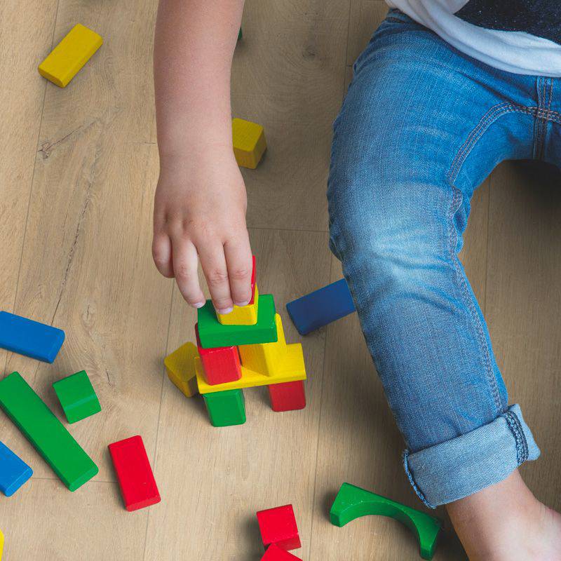 child playing on quick step soft oak medium laminate flooring