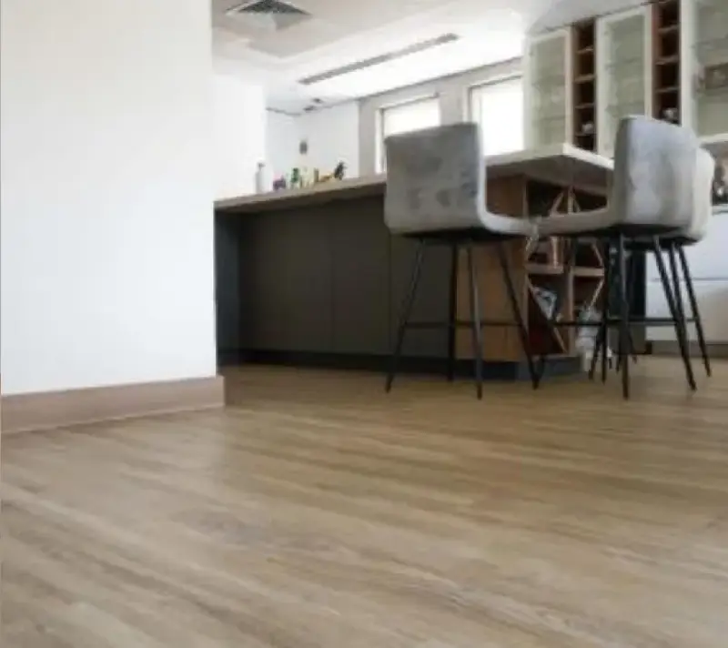 a living space with a wood laminate floor