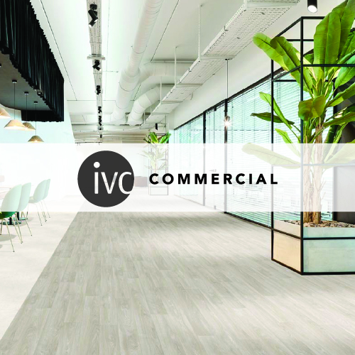 ivc commercial logo imposed over a large office space with light white wooden plank flooring