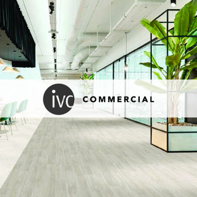 ivc commercial logo imposed over a large office space with light white wooden plank flooring