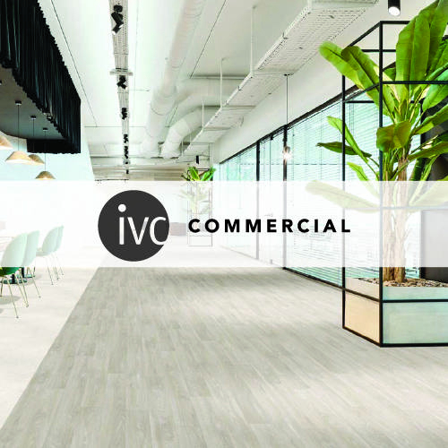 ivc commercial logo imposed over a large office space with light white wooden plank flooring