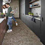 berry alloc pure tiles terrazzo dark grey vinyl click tiles in kitchen with couple