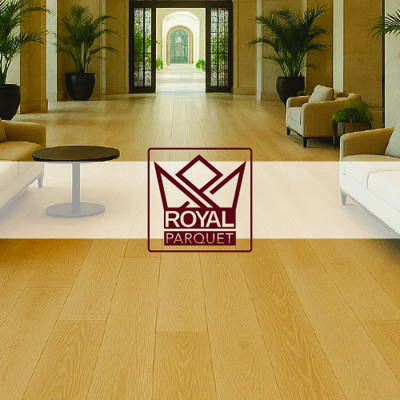 deep red royal parquet logo imposed over light wooden parquet flooring