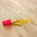 cup spilled across classic oak laminate beige floor