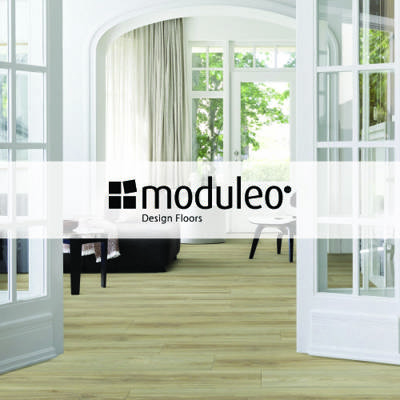 moduleo design floors logo imposed over open plan living space with light coloured engineered wood flooring