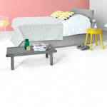 quick step white wood laminate plank flooring in a bedroom