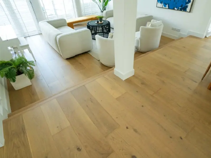living space with a light coloured wood plank floor
