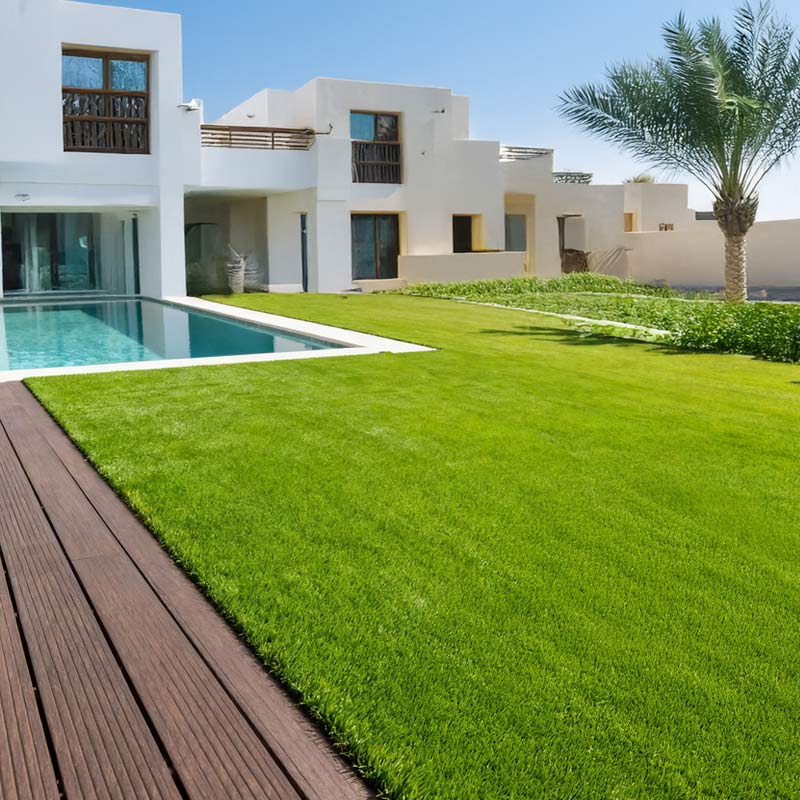 seneca artificial grass turf in villa back garden with pool and decking