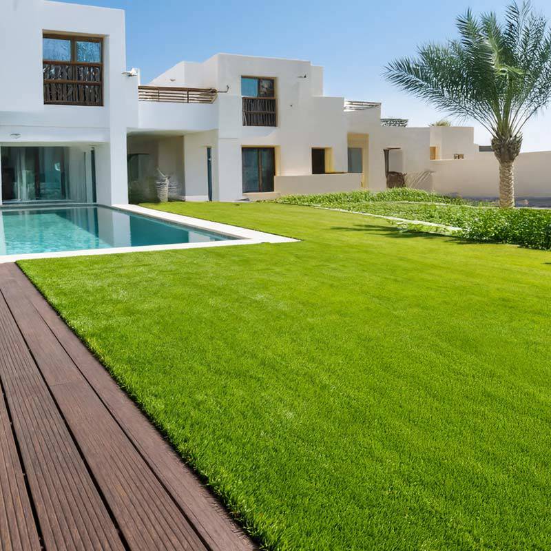 seneca artificial grass turf in villa back garden with pool and decking