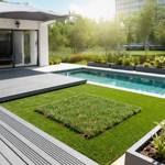 barun artificial grass turf squares in villa back garden next to pool