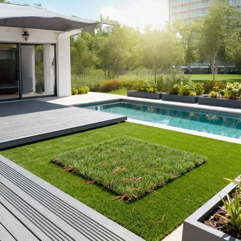 barun artificial grass turf squares in villa back garden next to pool