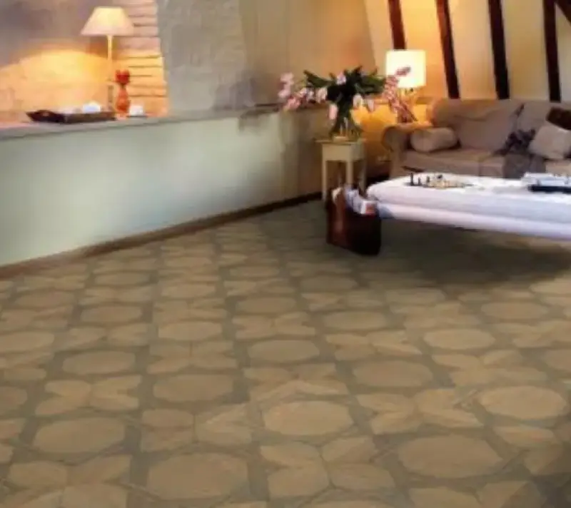 a living space with a tiled tan and borwn coloured floor