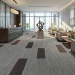 british carpet mill dark grey autumn patterned carpet tiles in high rise reception
