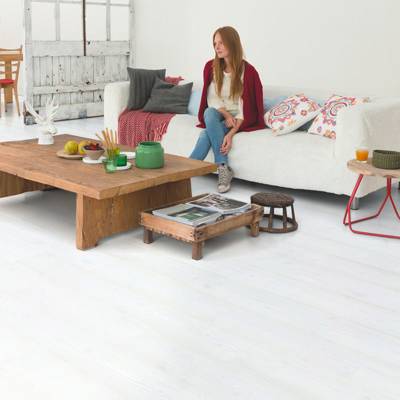 quick step white wood laminate plank flooring in a living room