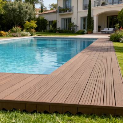 tobacco brown smart decking in villa back garden with pool