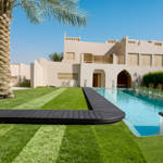 kakadu artificial grass in villa back garden next to pool and decking