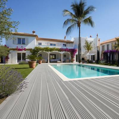 warm grey smart decking in villa garden with pool